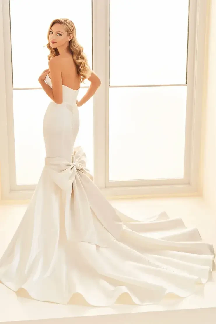 model is wearing a strapless mermaid wedding dress